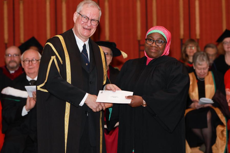 Receiving scholarship money at convocation