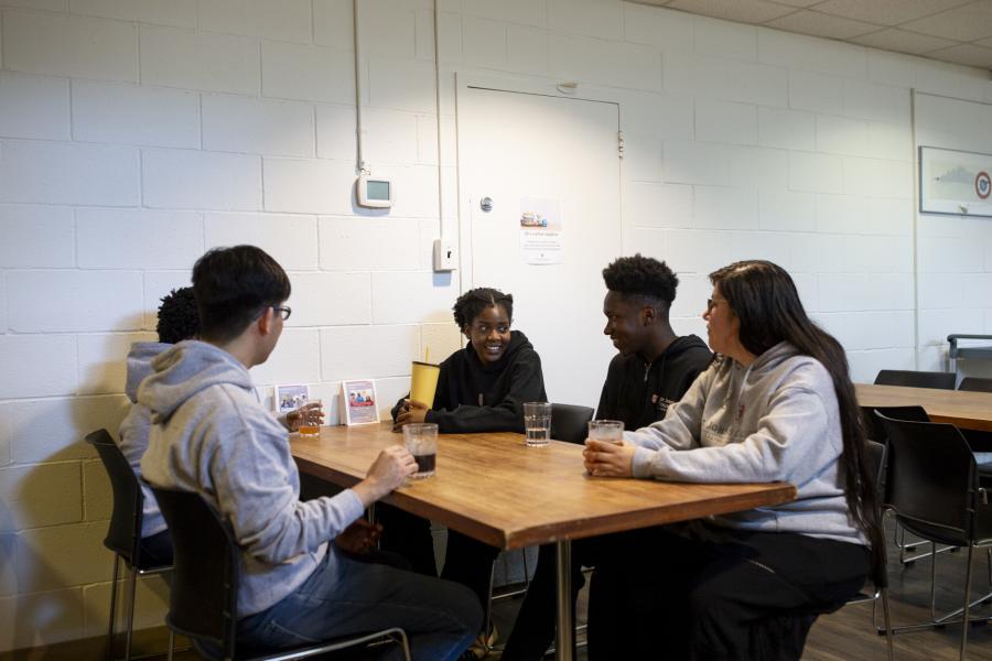 Dons of St John's Residence sitting at a table in the dinning room