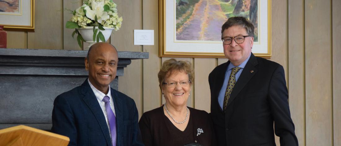 Prof. Rosemarie Finlay is congratulated by Dr. Dilantha Fernando and Dr. Christopher Adams on her 50th anniversary at the University of Manitoba