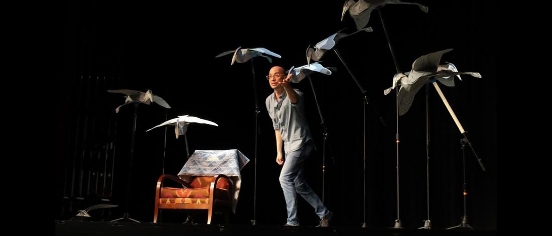 2026 Featured Festival Storyteller Adam Booth on stage performing his story, The Heron's Journey