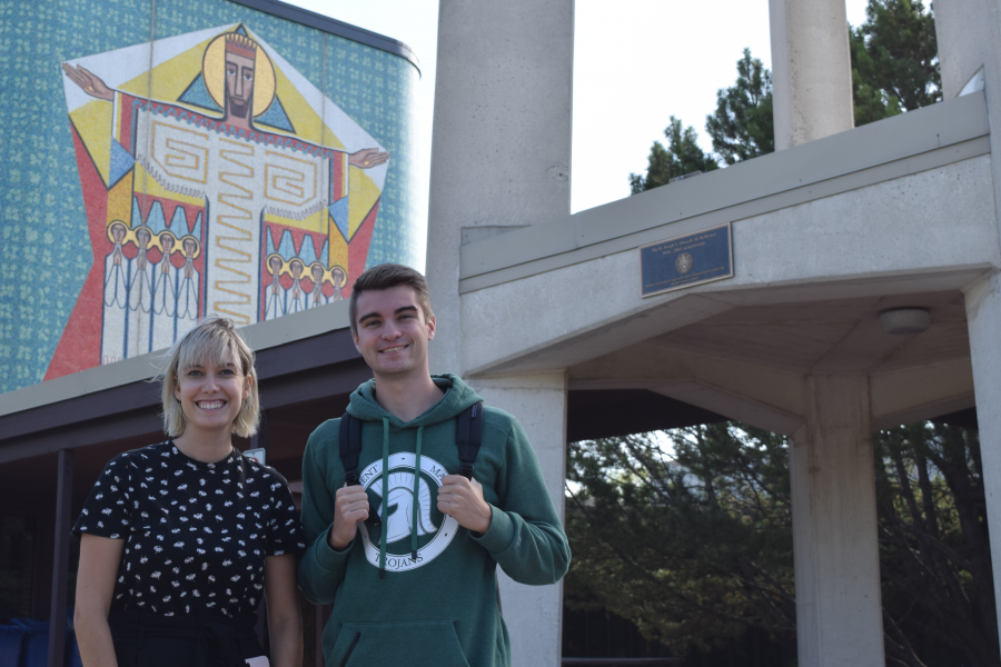 Two students in front of St. Paul's College