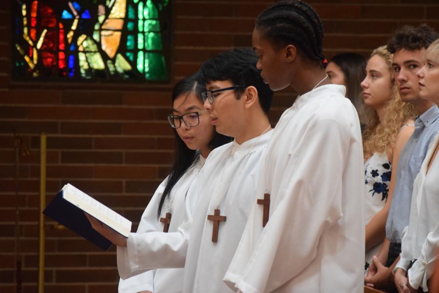 Students singing in Mass