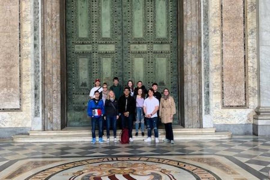 group picture in front of doors at saint john lateran papal archbasilica