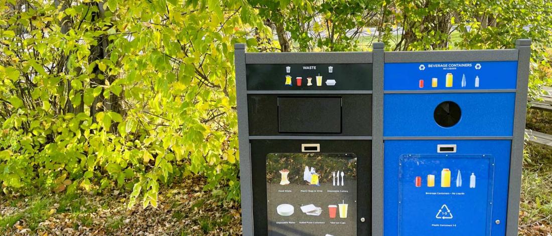 A garbage can and recycling can.
