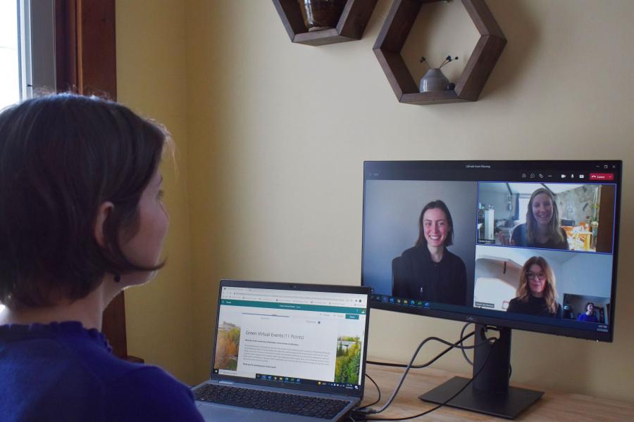 Four individuals participate in a virtual event on screen.
