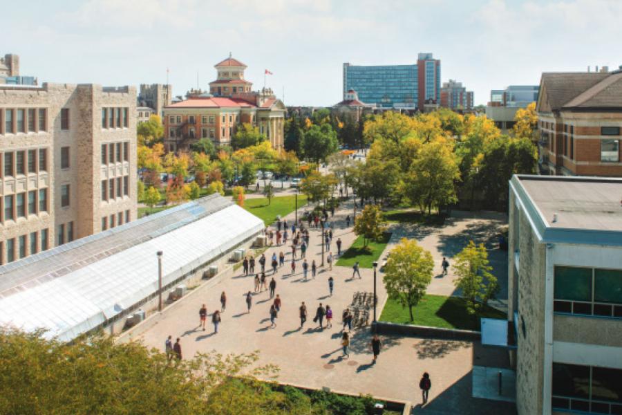 An overhead photograph of the Fort Garry University of Manitoba campus bustling with people.