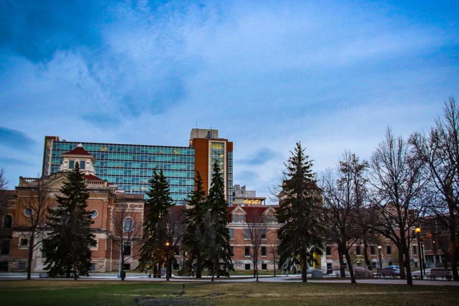 University of Manitoba campus building and walking paths at dusk.