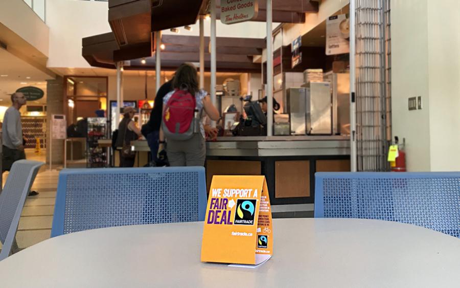 Fair Trade sign on a table at the Bannatyne campus.