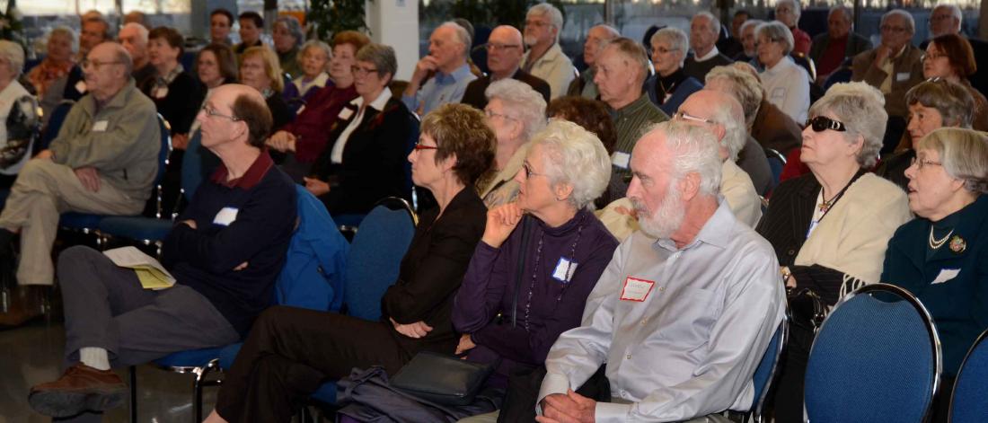 University of Manitoba Retirees Association members at an event listening to a speaker.