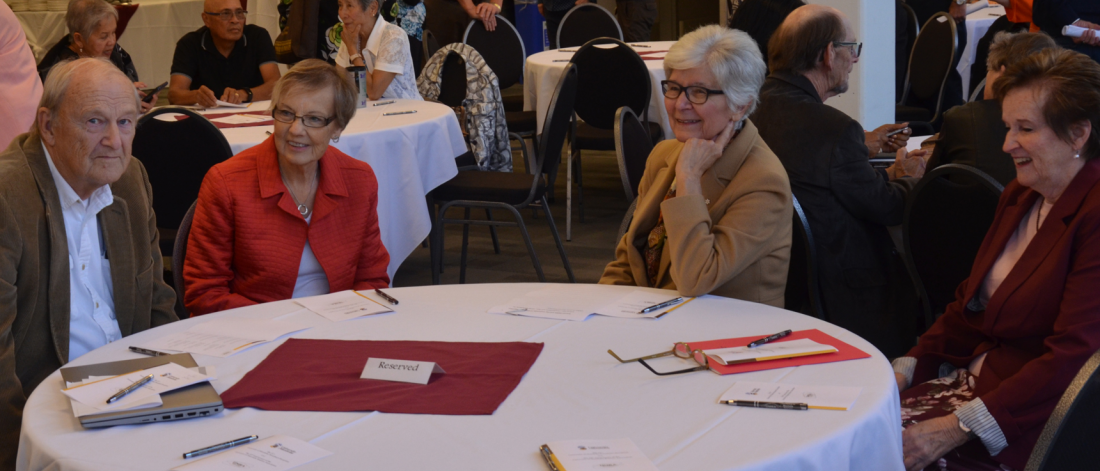 retirees sitting around table talking