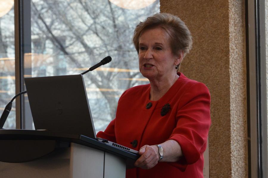 women-standing-at-podium