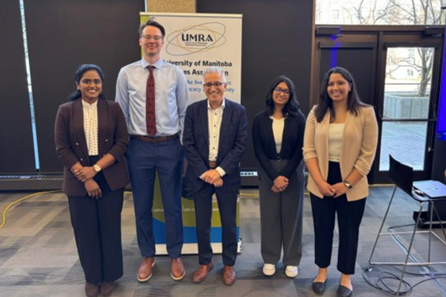 President Benarroch with 3MT graduate students at 2026 reception